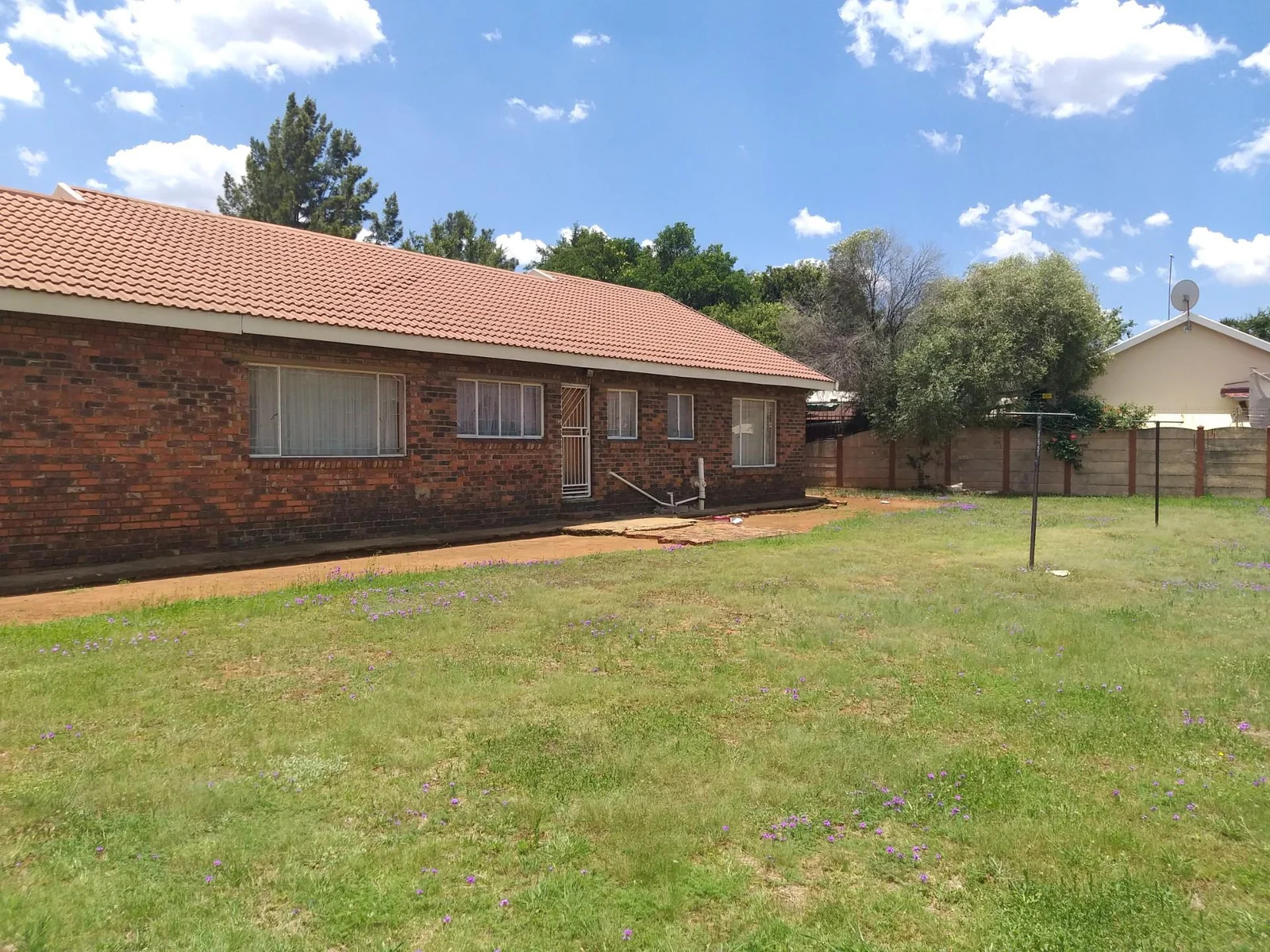 Sturdy family home on a large stand for sale in Unitas Park.