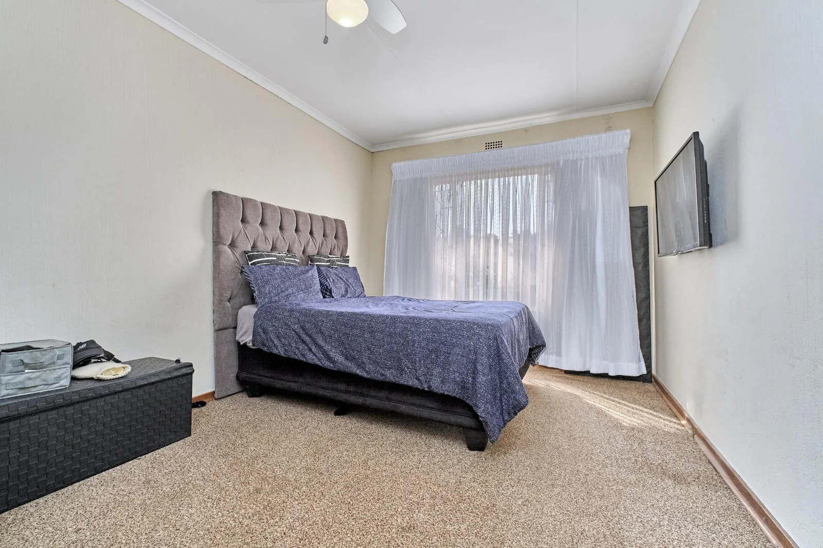 Double-story Townhouse with living spaces below, bedrooms upstairs, and a private garden.