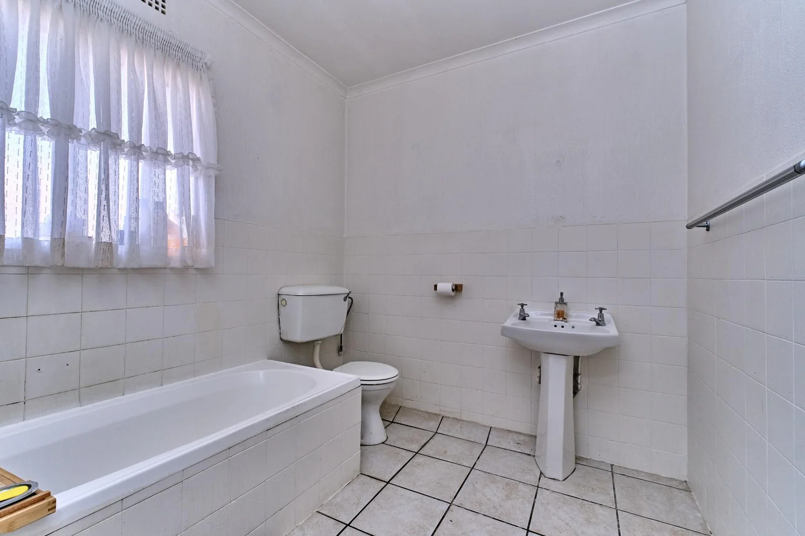 Double-story Townhouse with living spaces below, bedrooms upstairs, and a private garden.