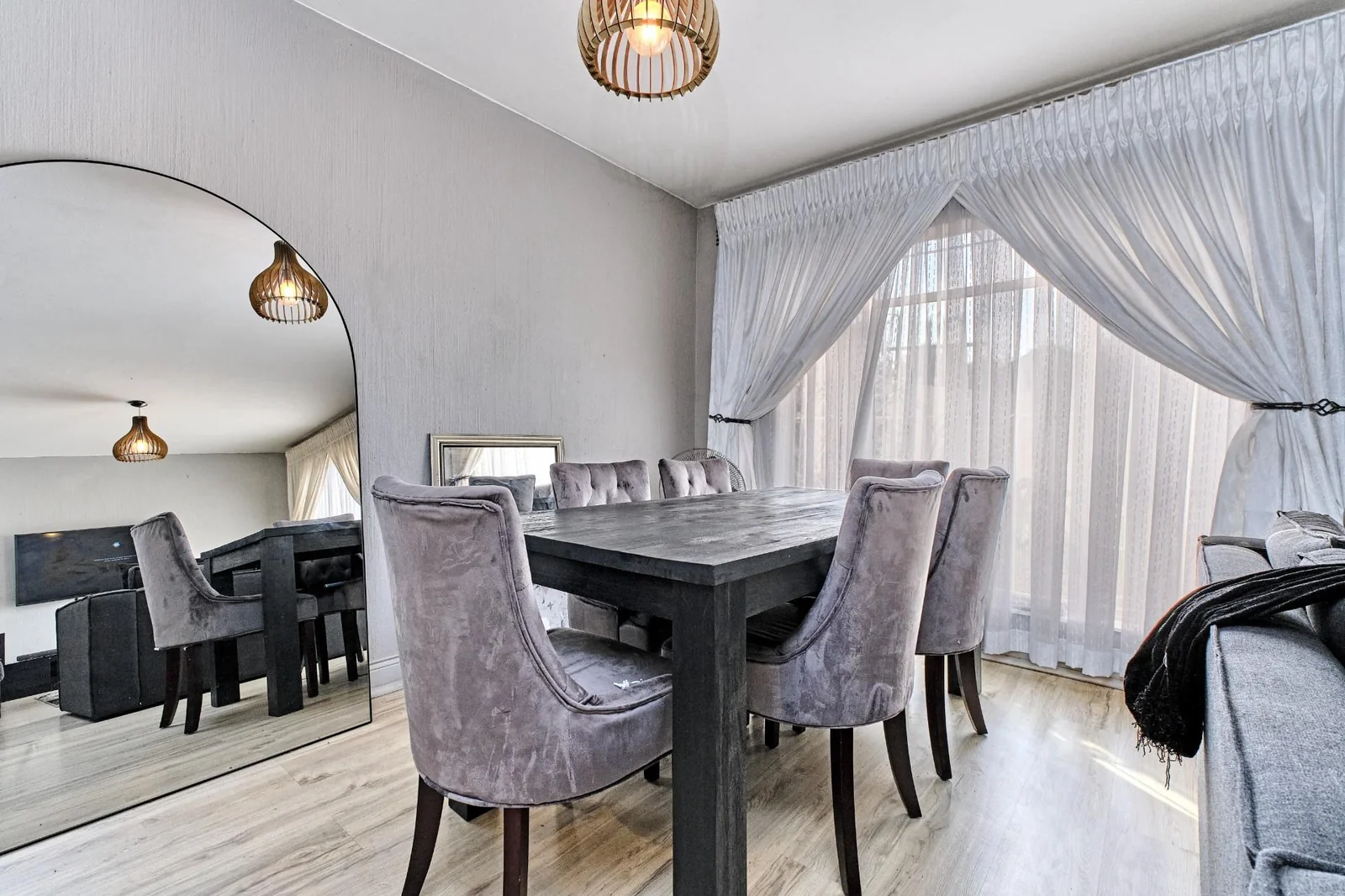 Double-story Townhouse with living spaces below, bedrooms upstairs, and a private garden.