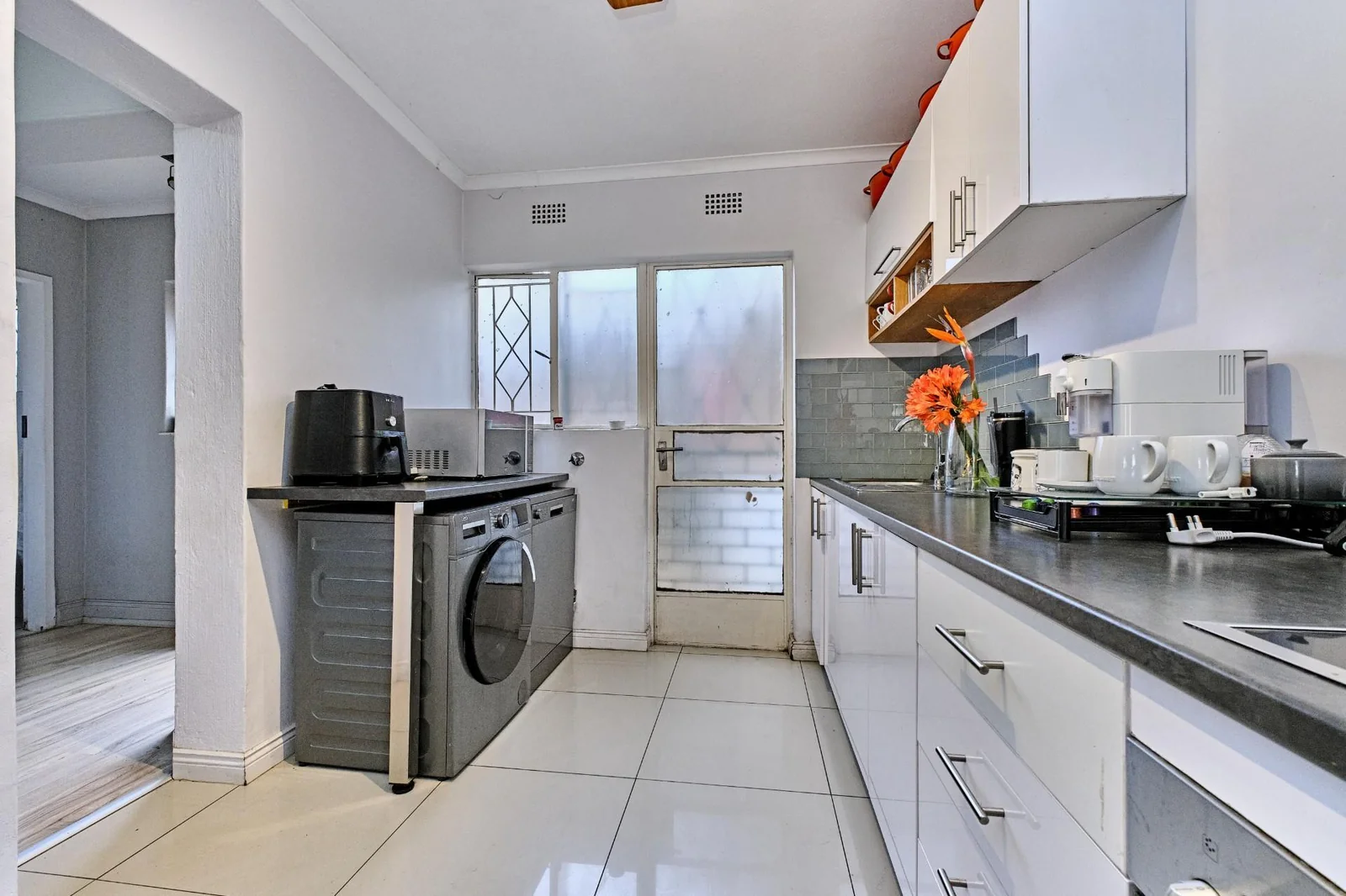 Double-story Townhouse with living spaces below, bedrooms upstairs, and a private garden.