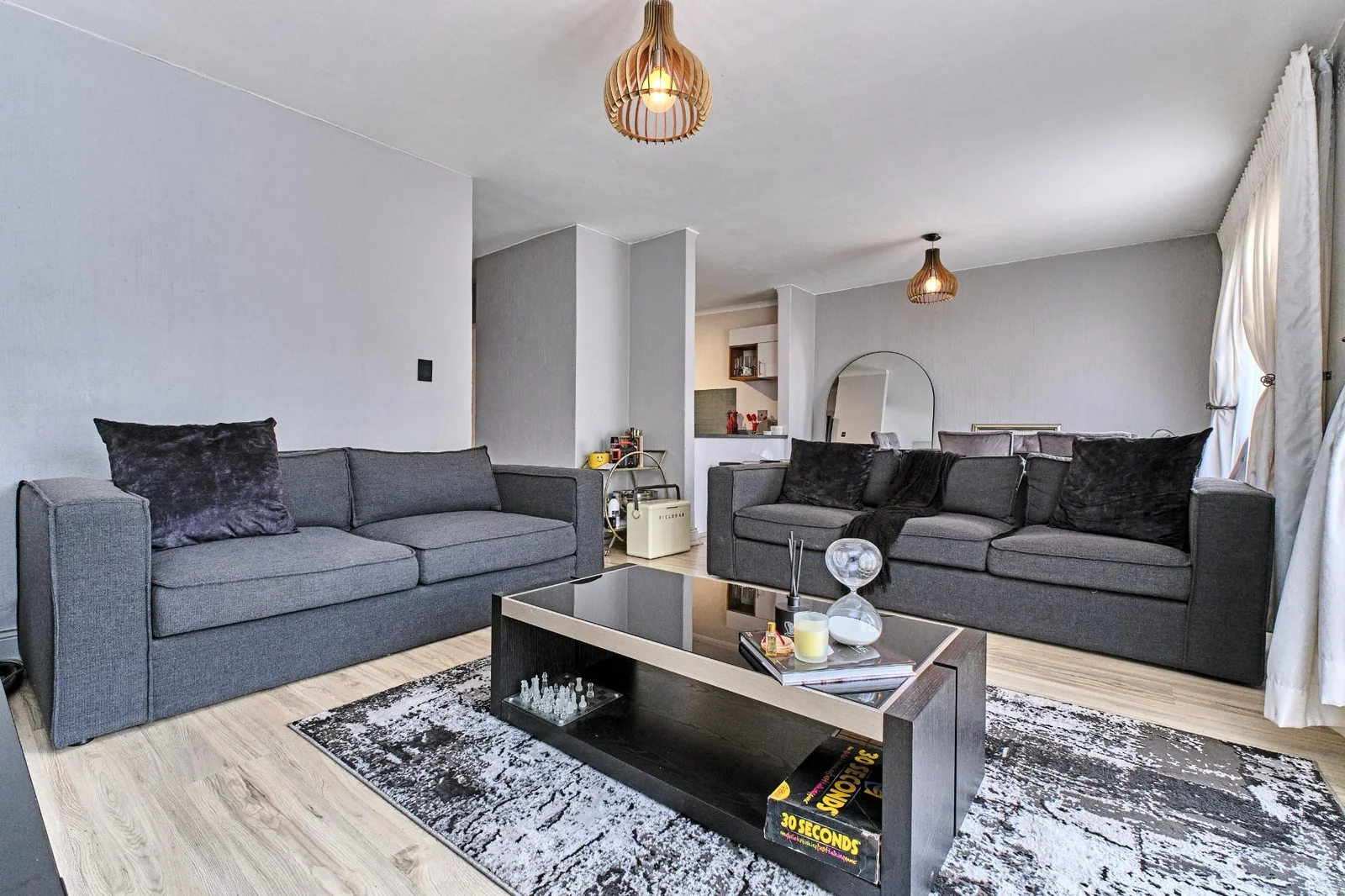 Double-story Townhouse with living spaces below, bedrooms upstairs, and a private garden.