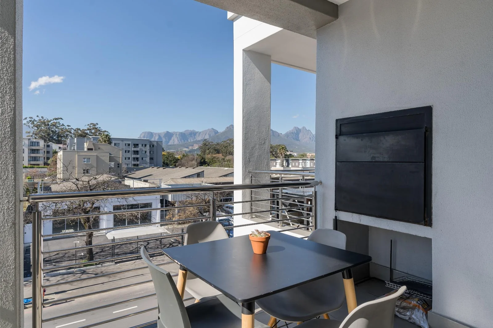 Corner living with two balconies, braai and mountain views – your Stellenbosch lifestyle starts here.