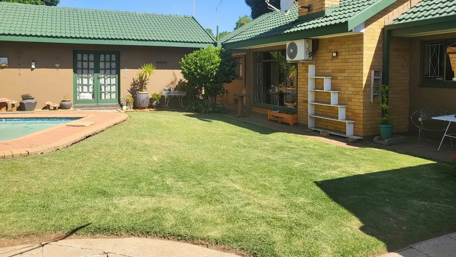 Reduced to sell!!  Well located family home with flatlet, swimming pool and salon area, for sale in Risiville.