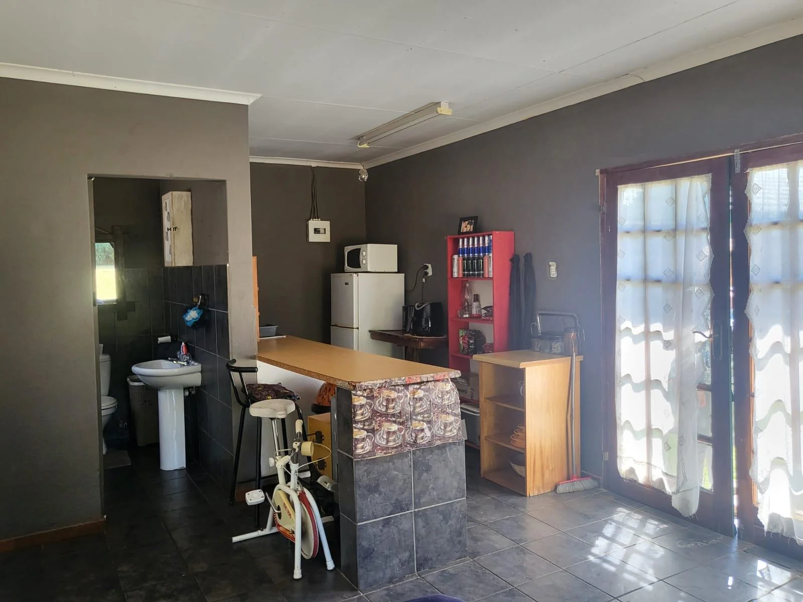 Reduced to sell!!  Well located family home with flatlet, swimming pool and salon area, for sale in Risiville.