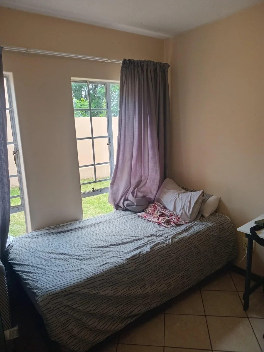 A lovely 2 bed ground apartment with  a Lockup garage in Erand Gardens, Midrand.