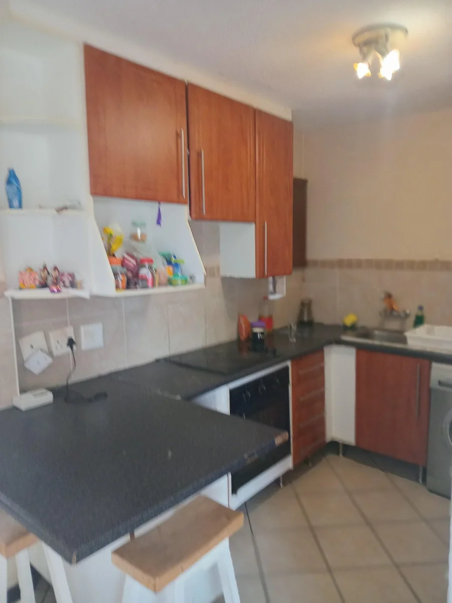 A lovely 2 bed ground apartment with  a Lockup garage in Erand Gardens, Midrand.