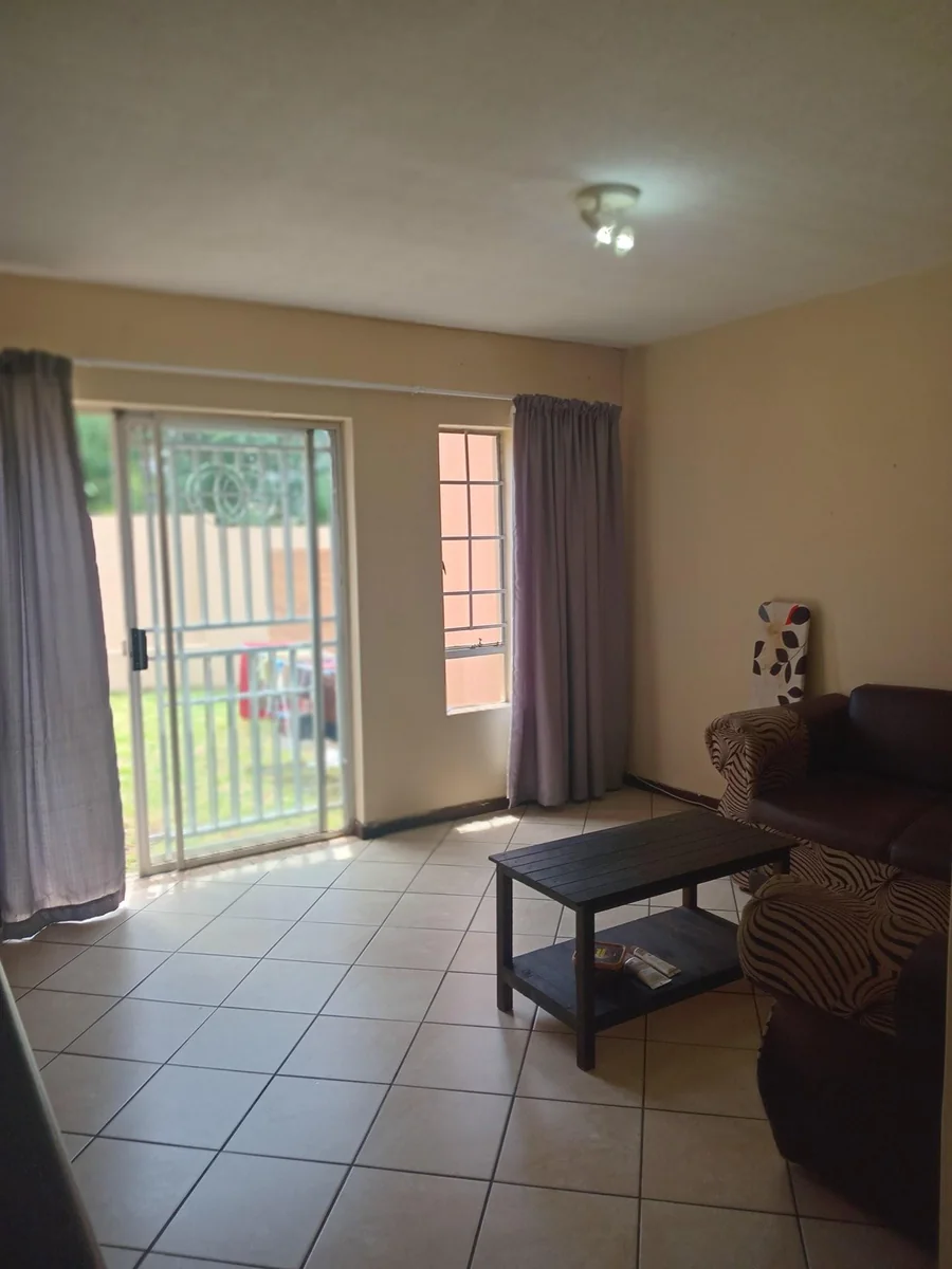 A lovely 2 bed ground apartment with  a Lockup garage in Erand Gardens, Midrand.