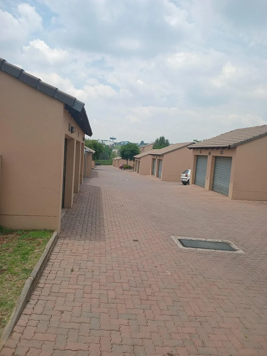 A lovely 2 bed ground apartment with  a Lockup garage in Erand Gardens, Midrand.