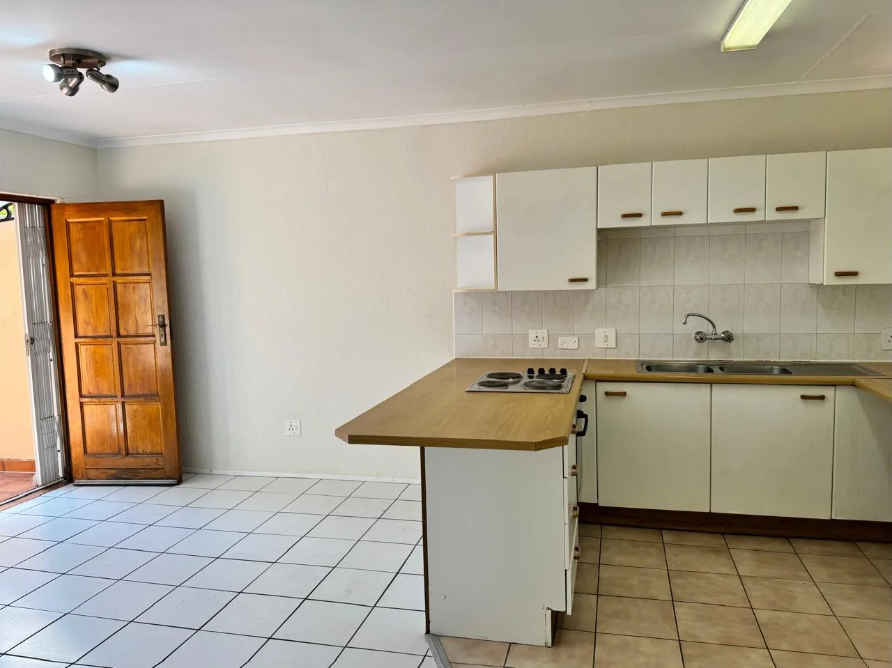 Sunlit 1-Bed Apartment with Communal Pool, Secure Access & Covered Parking for sale in Weltevreden Park
