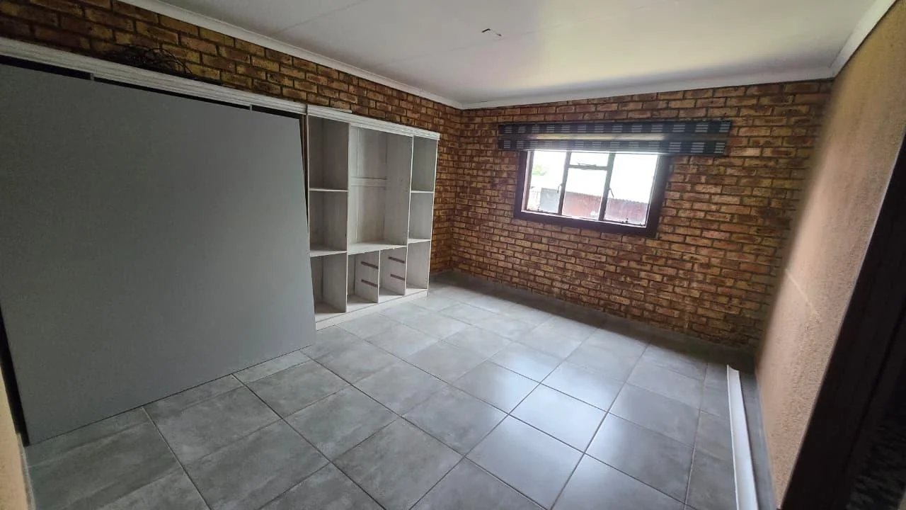 Spacious 8-Bedroom Investment Home with Flatlets and Wooden Houses