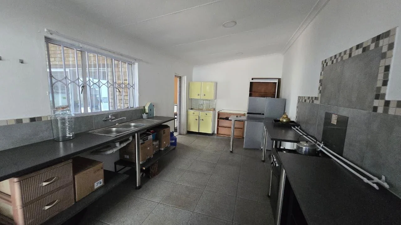 Spacious 8-Bedroom Investment Home with Flatlets and Wooden Houses