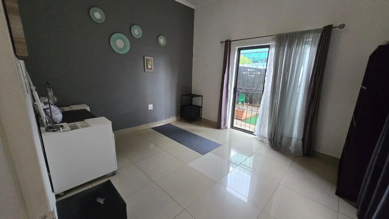 Spacious 8-Bedroom Investment Home with Flatlets and Wooden Houses