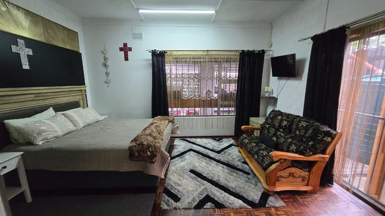 Spacious 8-Bedroom Investment Home with Flatlets and Wooden Houses