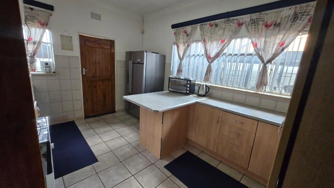 Spacious 8-Bedroom Investment Home with Flatlets and Wooden Houses