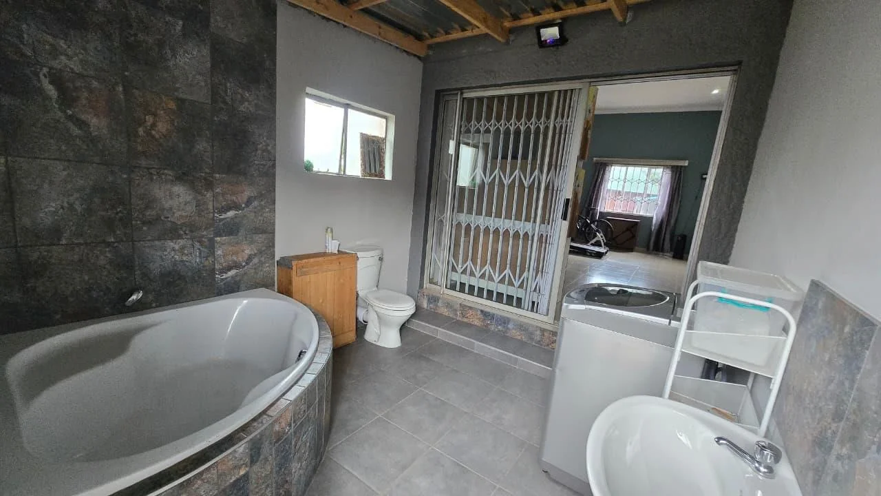 Spacious 8-Bedroom Investment Home with Flatlets and Wooden Houses