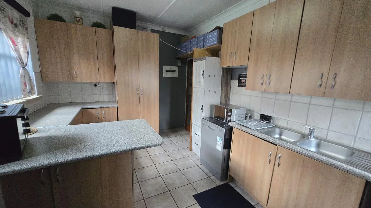 Spacious 8-Bedroom Investment Home with Flatlets and Wooden Houses