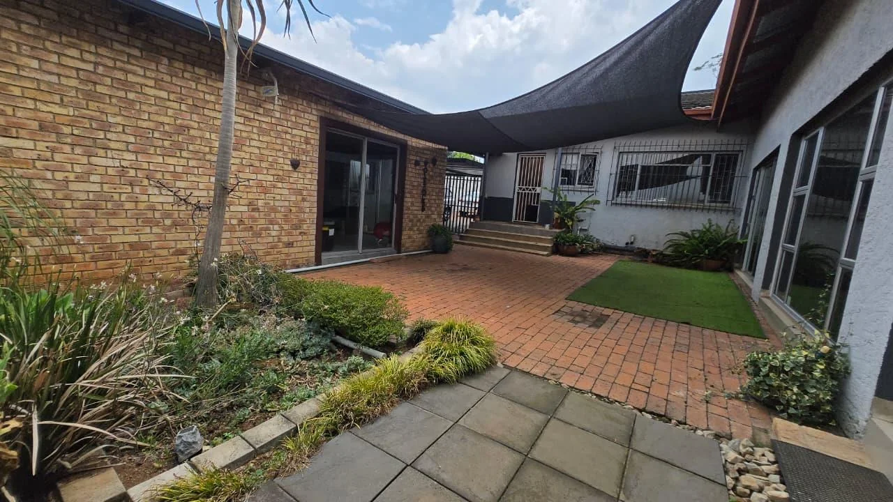 Spacious 8-Bedroom Investment Home with Flatlets and Wooden Houses