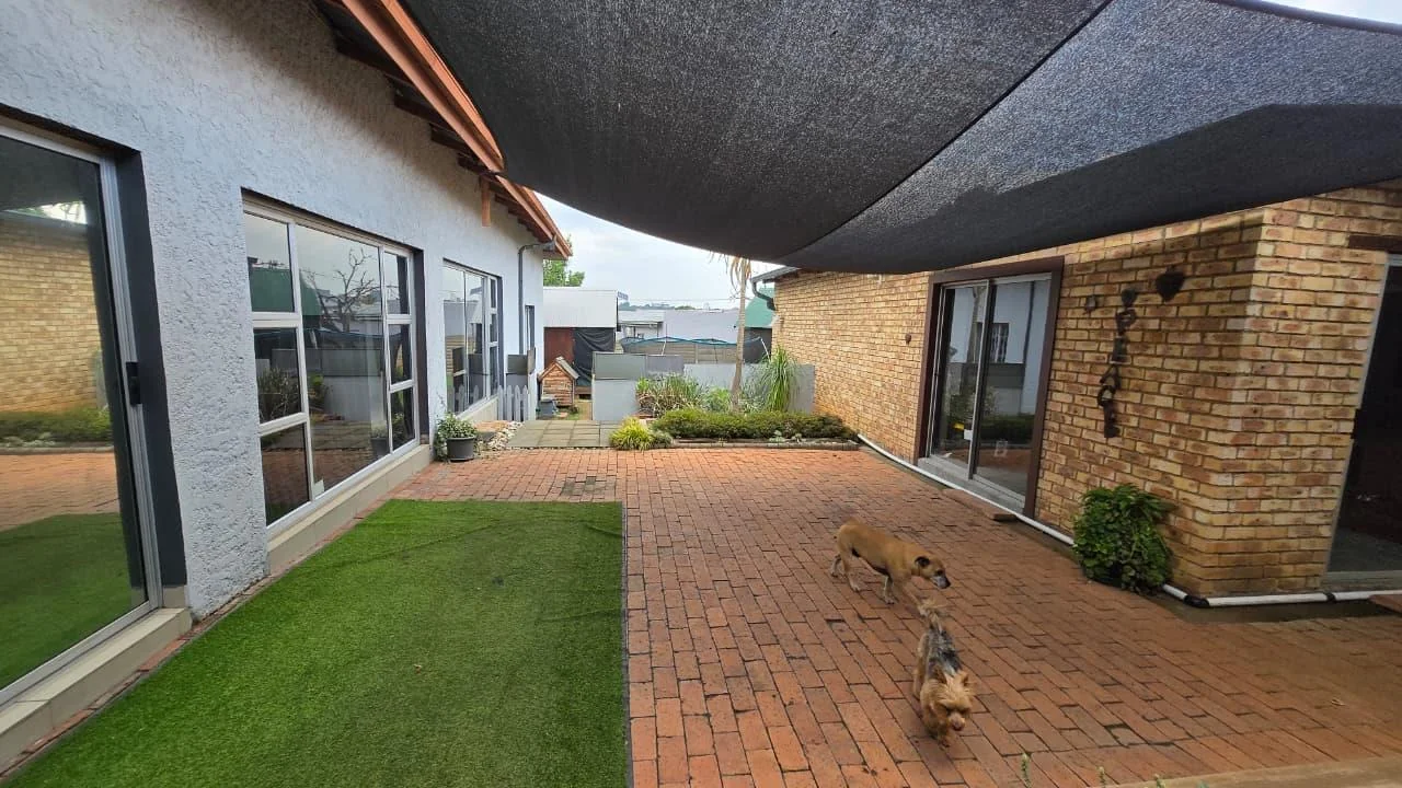 Spacious 8-Bedroom Investment Home with Flatlets and Wooden Houses