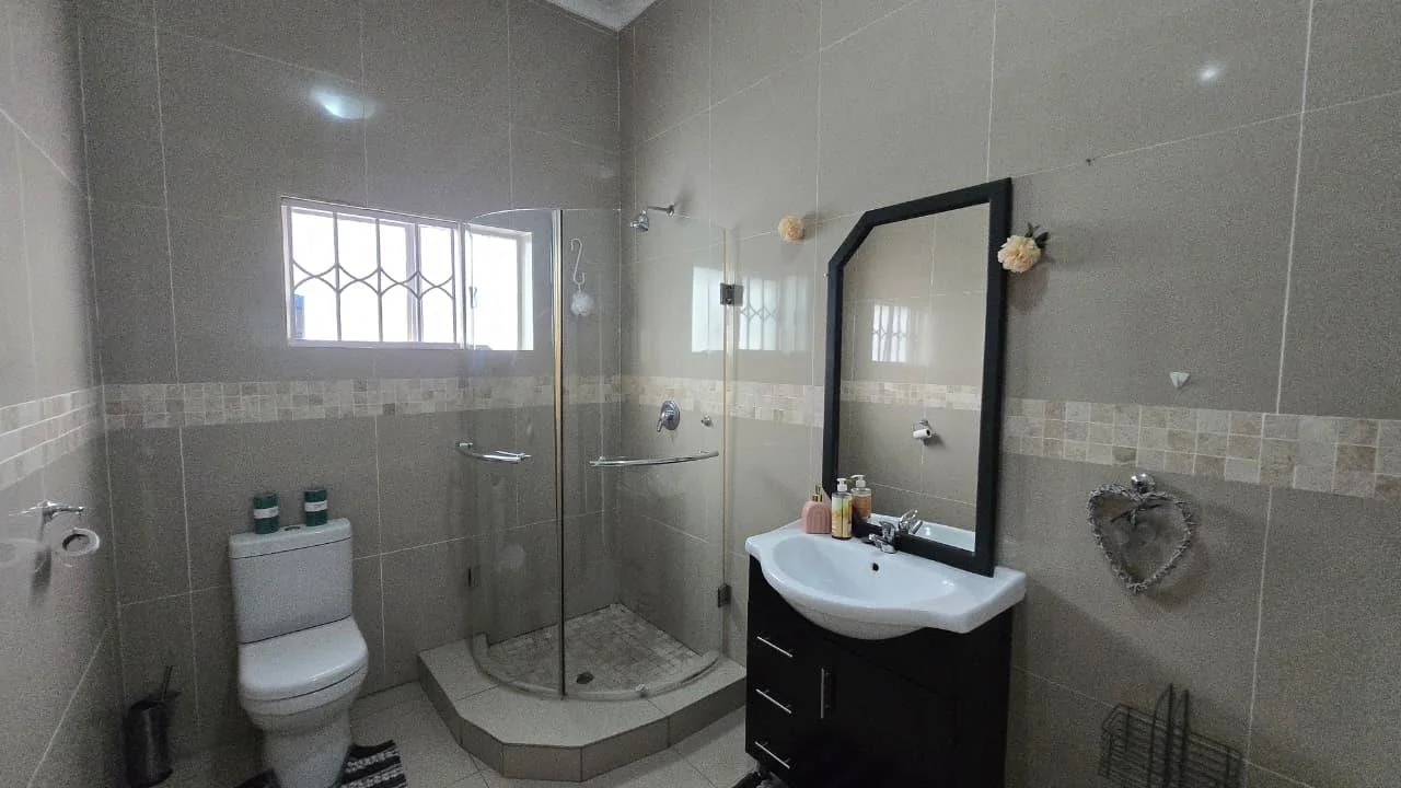 Spacious 8-Bedroom Investment Home with Flatlets and Wooden Houses