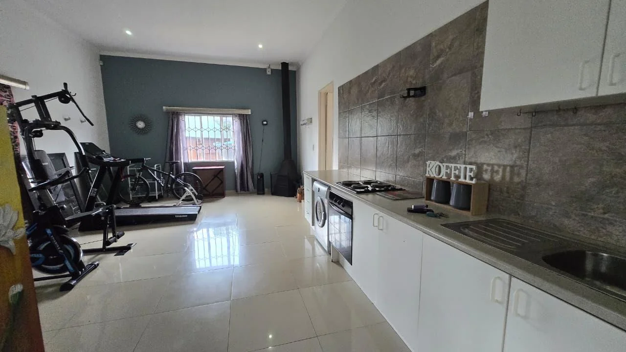 Spacious 8-Bedroom Investment Home with Flatlets and Wooden Houses