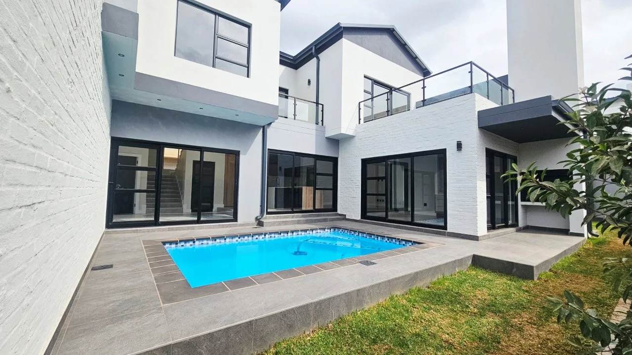 TURNKEY HOME WITH 3 GARAGES  AVAILABLE IN THE NEW DEVELOPING FOUNTAINBROOK ESTATE.