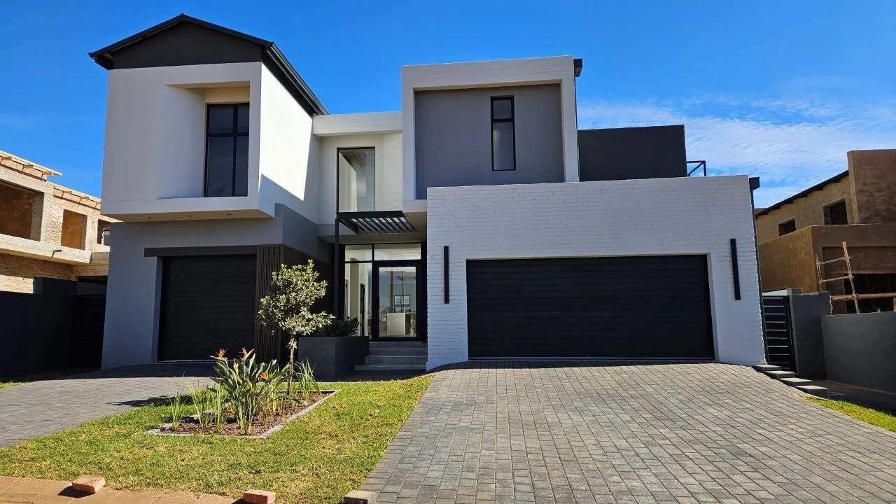 TURNKEY HOME WITH 3 GARAGES  AVAILABLE IN THE NEW DEVELOPING FOUNTAINBROOK ESTATE.