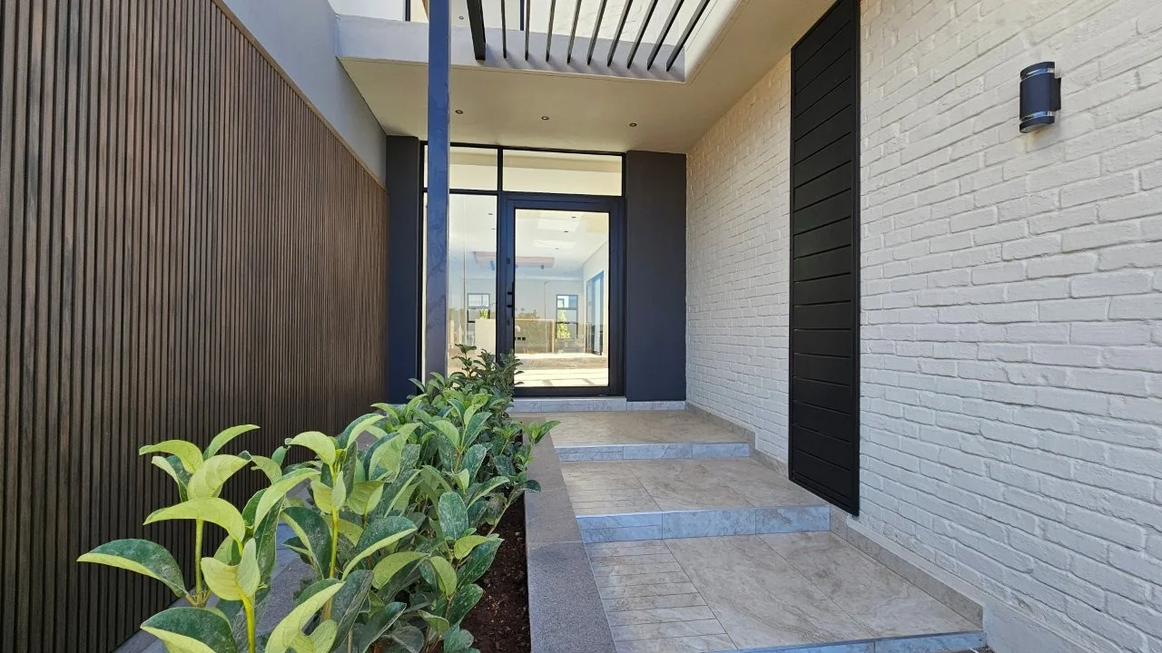 TURNKEY HOME WITH 3 GARAGES  AVAILABLE IN THE NEW DEVELOPING FOUNTAINBROOK ESTATE.