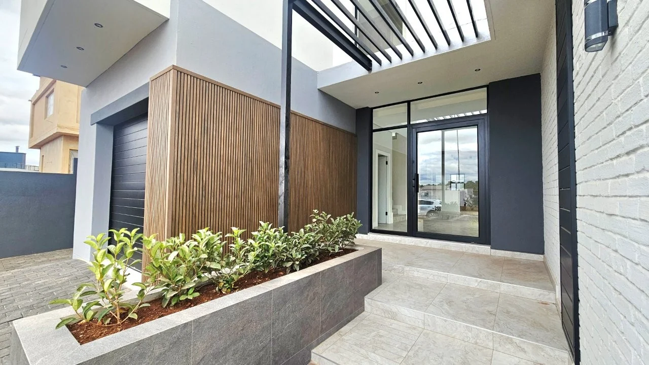TURNKEY HOME WITH 3 GARAGES  AVAILABLE IN THE NEW DEVELOPING FOUNTAINBROOK ESTATE.