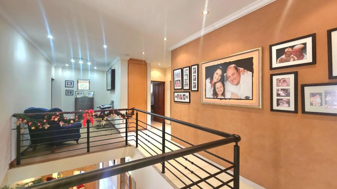GENEROUS FAMILY HOME WITH FLATLET IN THE HEART OF MIDSTREAM ESTATE.