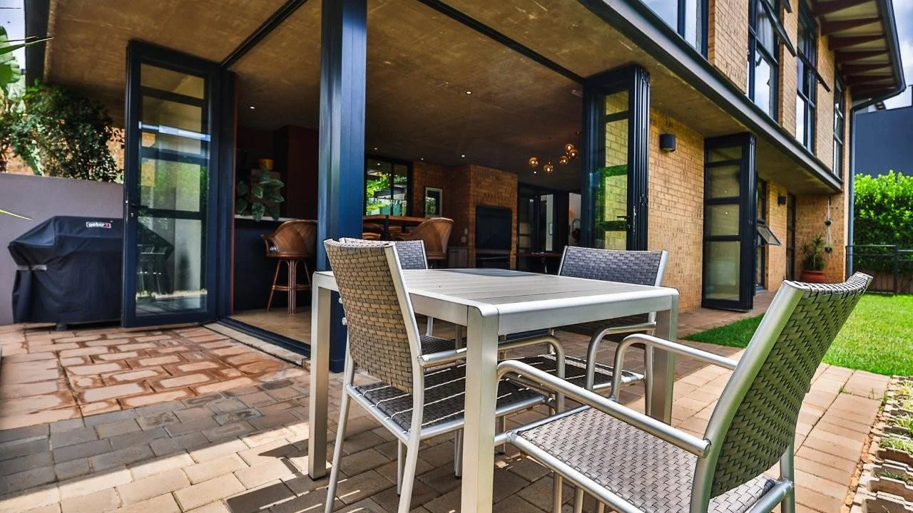 A STRIKING INDUSTRIAL-MODERN HOME WITH A PRIME MIDSTREAM RIDGE LOCATION, MOMENTS FROM AN  ACCESS GATE