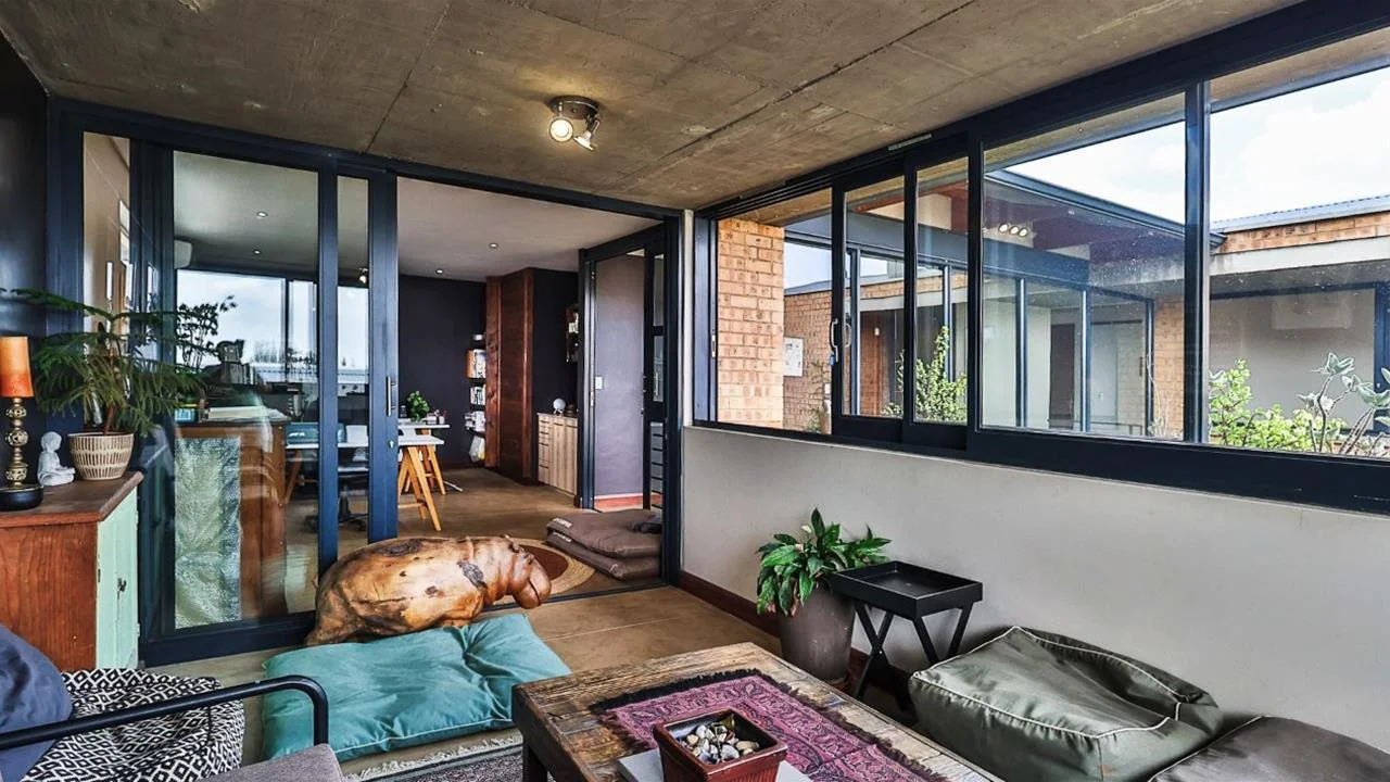 A STRIKING INDUSTRIAL-MODERN HOME WITH A PRIME MIDSTREAM RIDGE LOCATION, MOMENTS FROM AN  ACCESS GATE