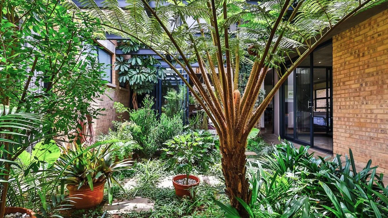 A STRIKING INDUSTRIAL-MODERN HOME WITH A PRIME MIDSTREAM RIDGE LOCATION, MOMENTS FROM AN  ACCESS GATE