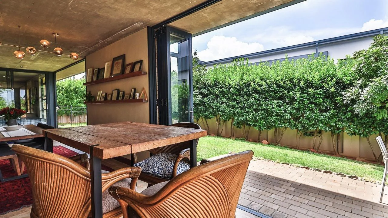 A STRIKING INDUSTRIAL-MODERN HOME WITH A PRIME MIDSTREAM RIDGE LOCATION, MOMENTS FROM AN  ACCESS GATE