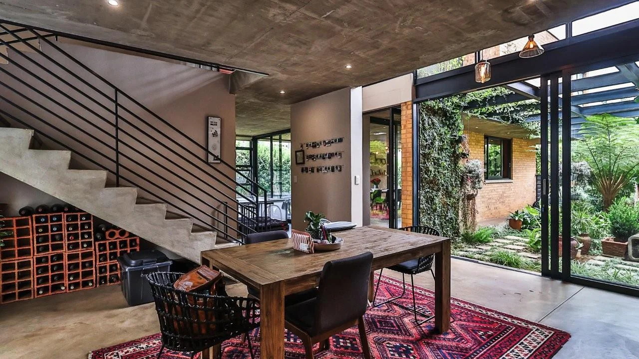 A STRIKING INDUSTRIAL-MODERN HOME WITH A PRIME MIDSTREAM RIDGE LOCATION, MOMENTS FROM AN  ACCESS GATE