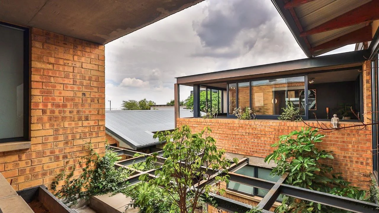 A STRIKING INDUSTRIAL-MODERN HOME WITH A PRIME MIDSTREAM RIDGE LOCATION, MOMENTS FROM AN  ACCESS GATE