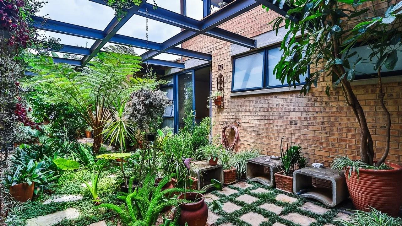 A STRIKING INDUSTRIAL-MODERN HOME WITH A PRIME MIDSTREAM RIDGE LOCATION, MOMENTS FROM AN  ACCESS GATE