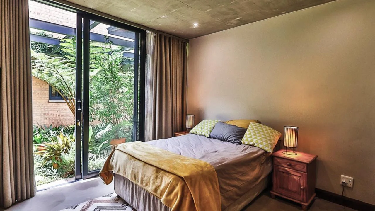 A STRIKING INDUSTRIAL-MODERN HOME WITH A PRIME MIDSTREAM RIDGE LOCATION, MOMENTS FROM AN  ACCESS GATE