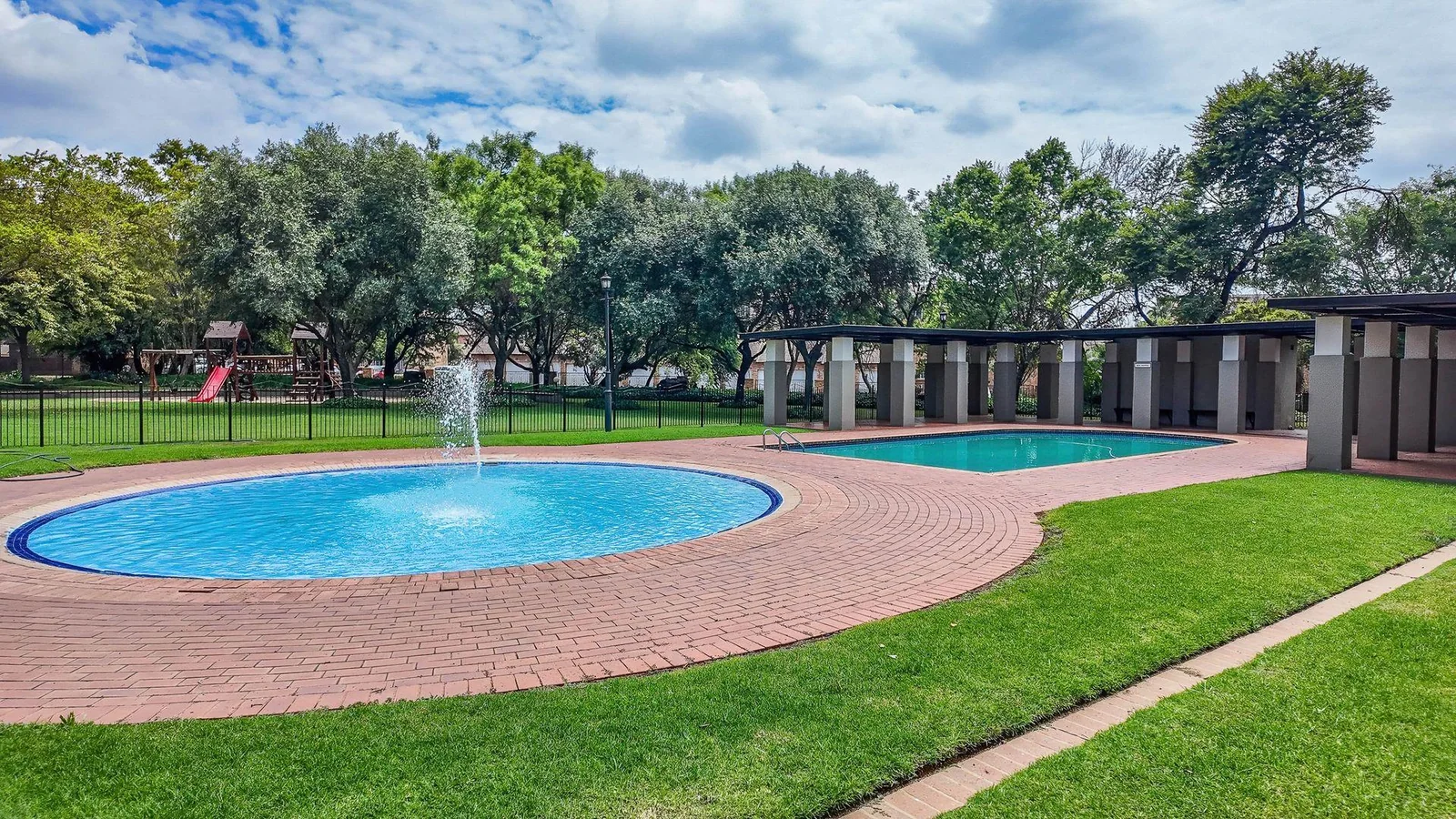 Welcome to this spacious 120sqm first-floor corner unit located in the ever-popular and well-secured Eco Park Estate, right in the heart of Centurion.