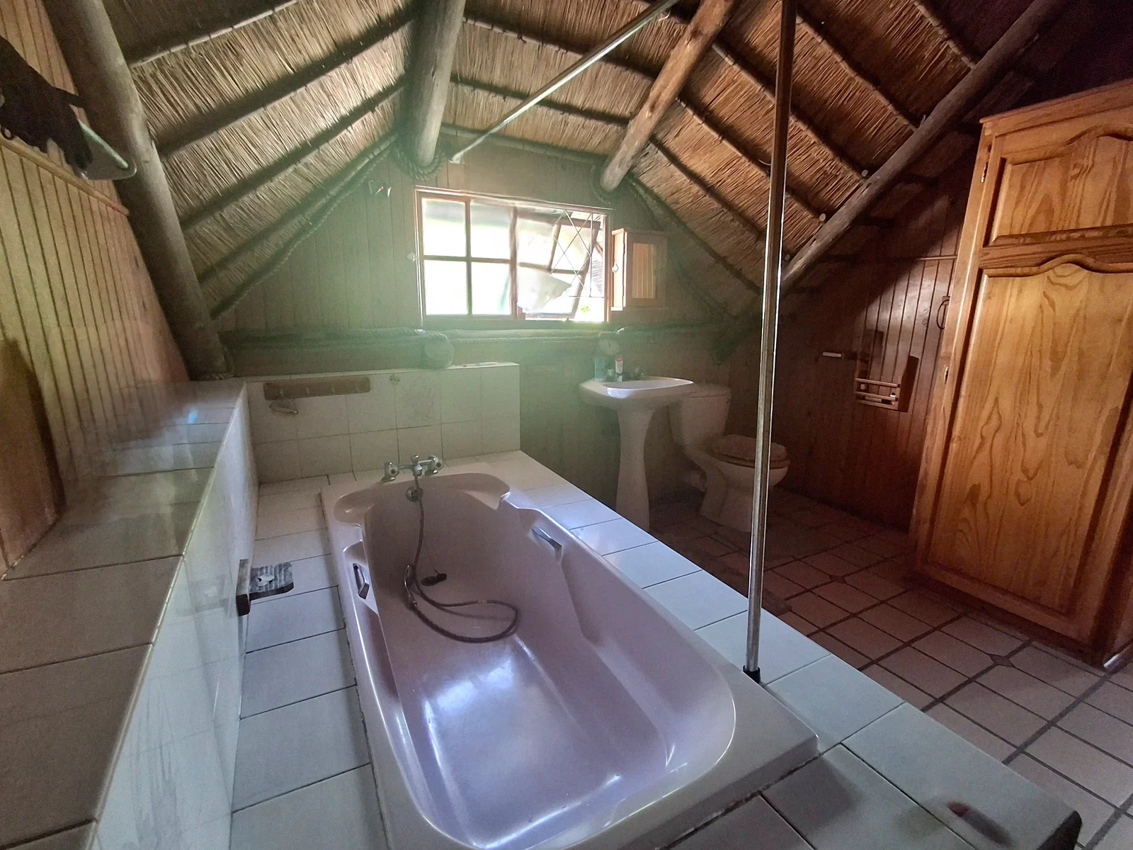 Thatched roof and warm wood interior