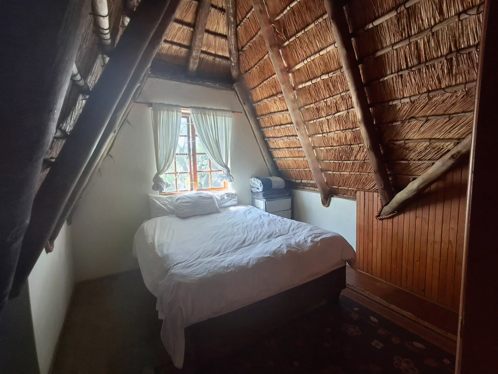 Thatched roof and warm wood interior
