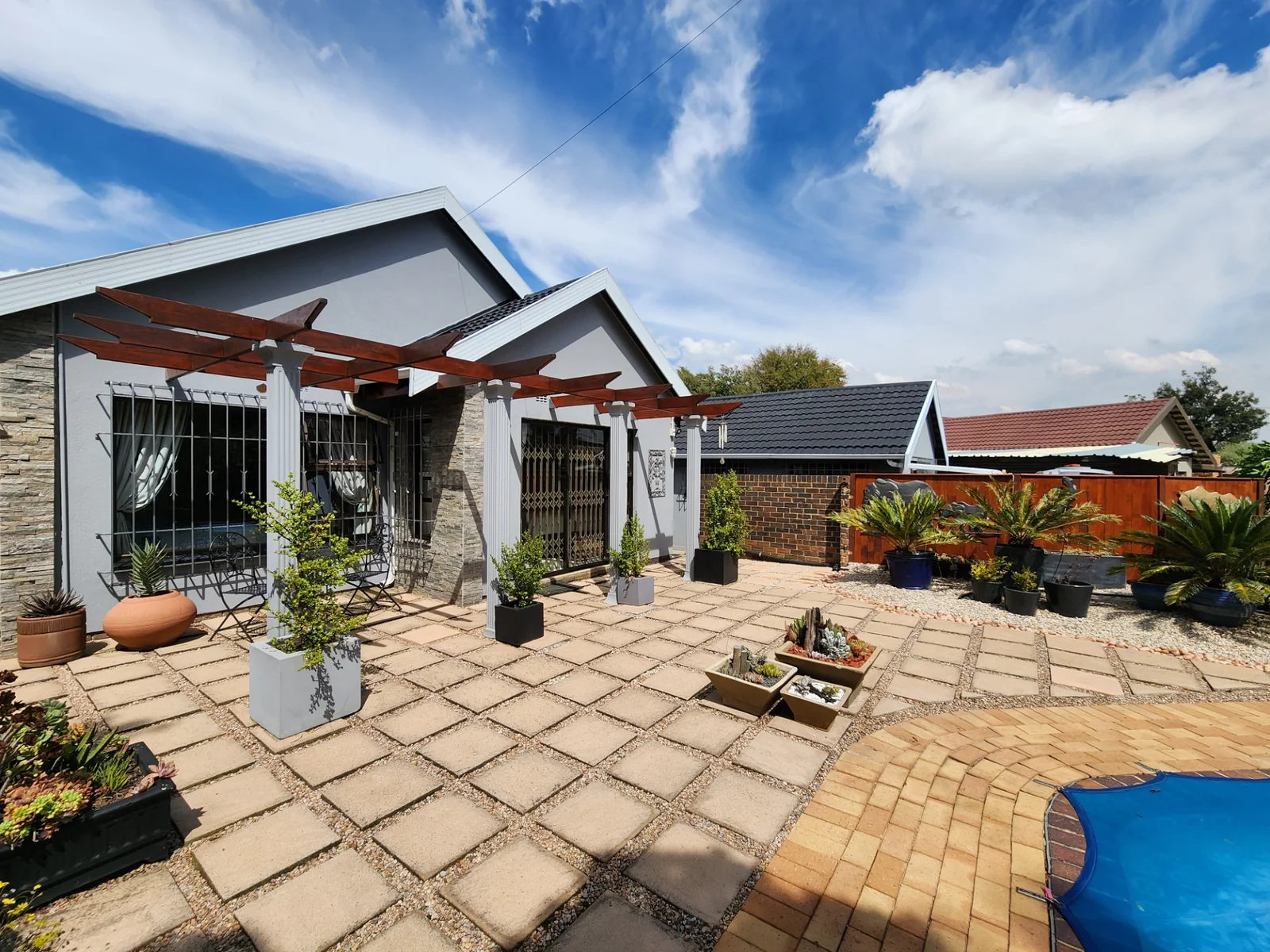 Light Filled Living, Curated Gardens and Energy Independence in Farrarmere