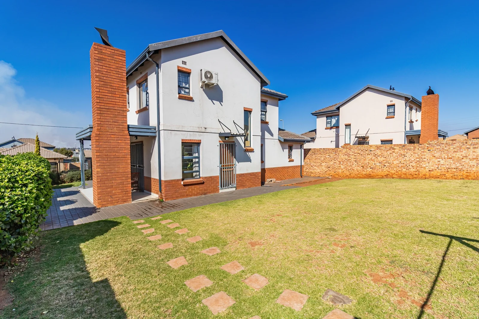 Secure Family Living in Clayville, Midrand: Spacious 4 Bedroom Estate Home with Big Yard.