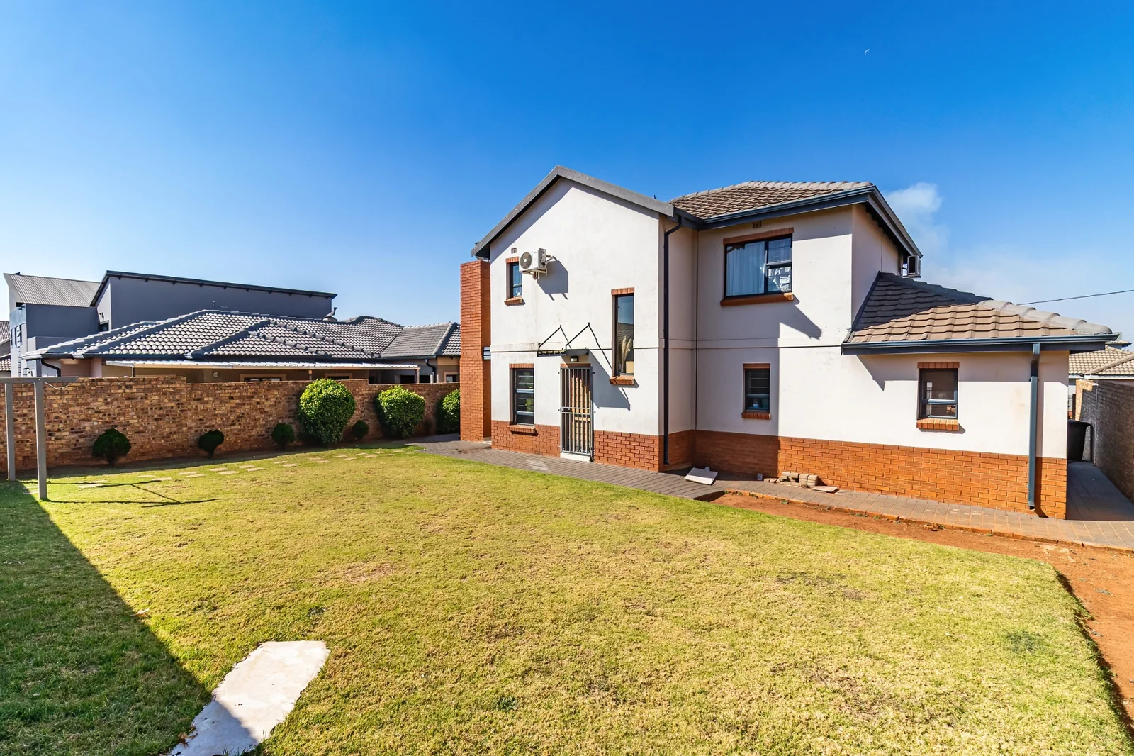 Secure Family Living in Clayville, Midrand: Spacious 4 Bedroom Estate Home with Big Yard.