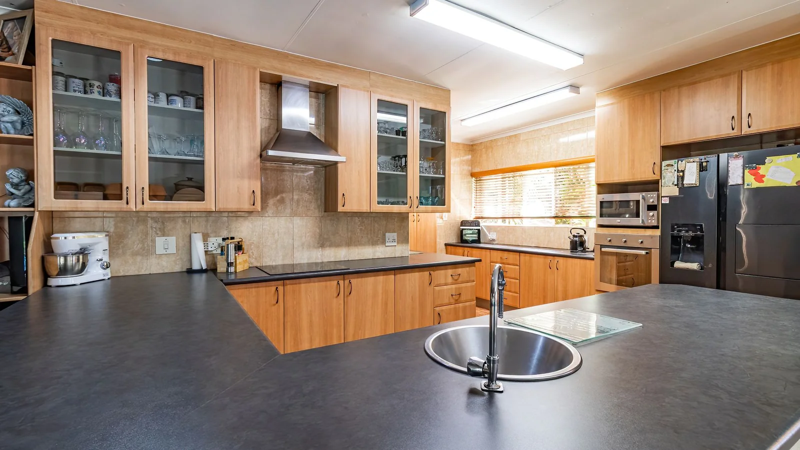 3-BEDROOM HOME WITH PRIVATE 2-BEDROOM FLATLET, INCOME POTENTIAL & ENTERTAINMENT SPACES IN A SECURE BOOMED-OFF AREA