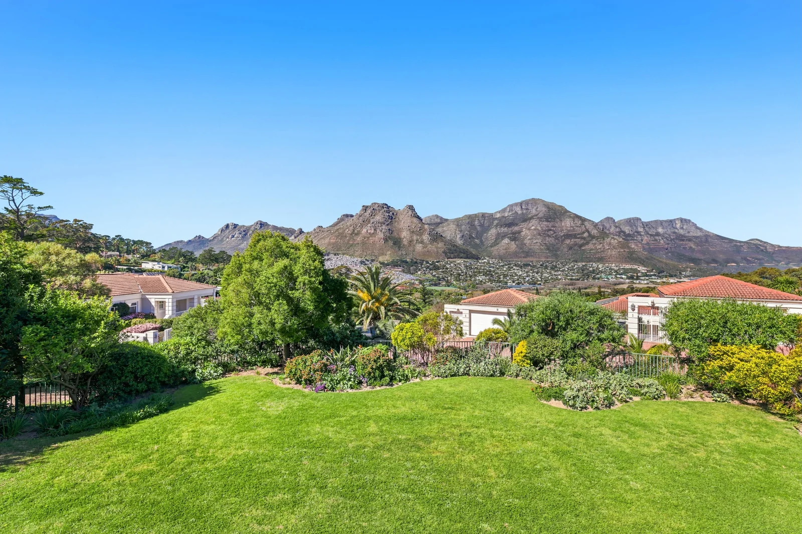 Unique Offering - two adjacent Properties, a 4 bedroom home and adjacent plot of land, in Elevated Security Estate!