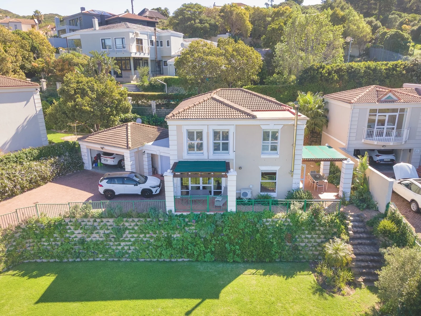 Unique Offering - two adjacent Properties, a 4 bedroom home and adjacent plot of land, in Elevated Security Estate!